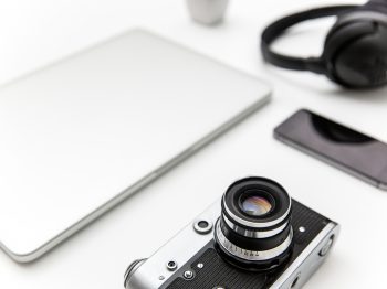 Laptop, blank screen smartphone, old camera, and headphones over white background nidnoiit, nidnoiit.com, นิดหน่อยไอที, นิดหน่อย ไอที, ร้านนิดหน่อย, ขาย, จำนำ, ขายฝาก, มือสอง, สินค้ามือสอง, สินค้าไอที, โทรศัพท์มือถือ, Smartphone, iPhone, iPad, Tablet, Samsung, กล้องDSLR, กล้องmirrorless, โน๊ตบุ๊ค, Notebook, คอมพิวเตอร์, PC, ทีวี, TV, เครื่องเสียง, เกมPSP4, Nintendo, Gopro, iPadPro, IPhone4, IPhone5, IPhone5s, IPhone6, IPhone6s, IPhone7, IPhone8, IPhonex, IPhonexs, IPhonexsmax, IPhonexr, IPhone6plus, IPhone7plus, IPhone8plus, CANON, NIKON, LEICA, Fuji, SONY, OLYMPUS, PANASONIC, CASIO, Apple, Samsung, OPPO, Vivo, Huawei, Xiaomi Mi, Nokia, ASUS, LG, Wiko